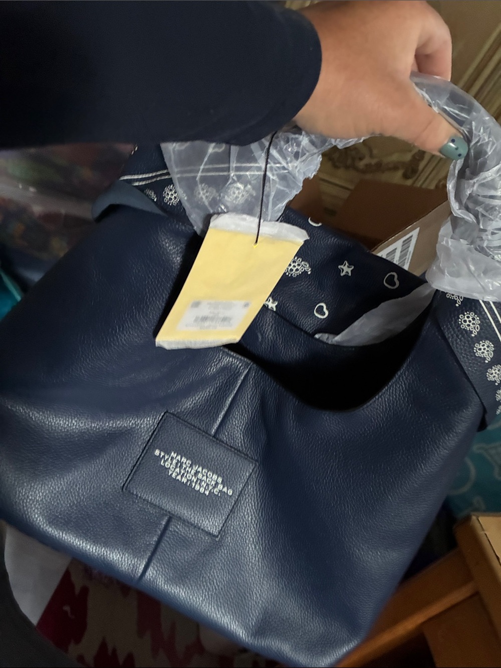 Marc Jacob’s navy blue pebbled hobo bag only